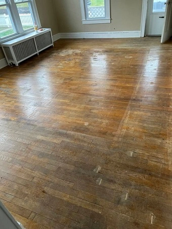 Wood floor looking scuffed and needing restoration and repair